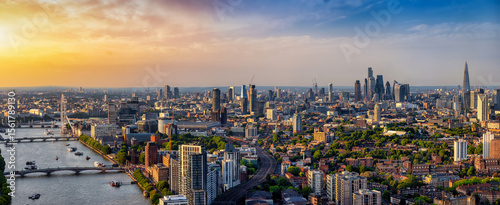 Panoramic landscape view of the London skyline seen from Nine Elms stretching from the City to Westminster during summer sunset time