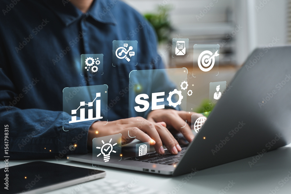 Naklejka premium Businessman using computer to analyze SEO, search engine optimization, marketing, traffic ranking, website, internet, business, technology, concept.