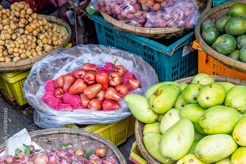 Diverse fresh fruits displayed at a vibrant market stall