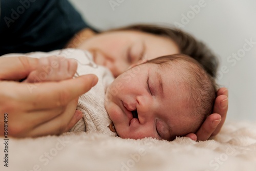 Mother and Newborn Sleeping Peacefully