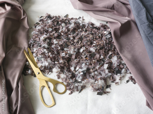 Recycling background. Zero waste. Textile recovery. Reusable of clothes. Second life. Recycling, reuse, circular, up cycling, reprocessing. Pieces of old clothes repurposing. Synthetic reuse.