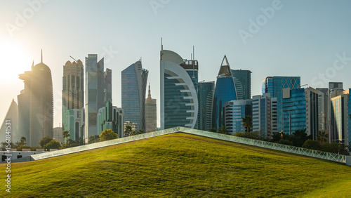 Tall modern skyscrapers tower over central park in Doha Qatar. beautiful panorama of the city.