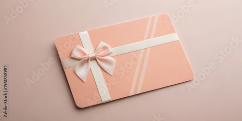 Elegant gift card with a bow on a soft background.