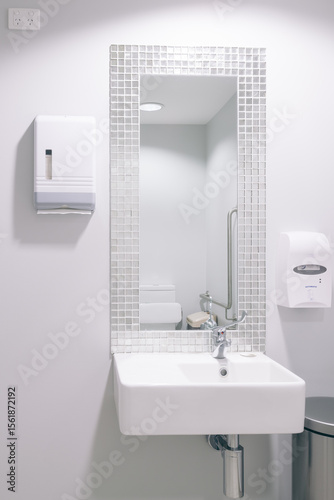 White basin in modern public bathroom