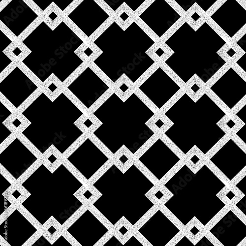 Seamless tile background. Black background with white ornamental pattern. Ancient pattern for floors and cladding. Geometric seamless pattern. Ornamental vintage background