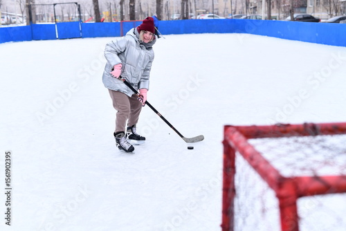 Photography People skate and play ice hockey in the yard