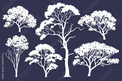 Collection of diverse white tree silhouettes on a dark blue background