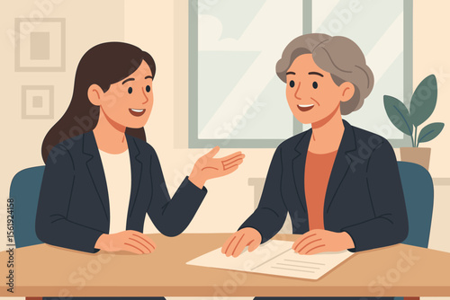 Businesswomen in a friendly office meeting. Young employee having a positive conversation with a senior female boss. Job interview, mentorship, career advice or teamwork concept.