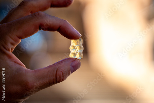 hand holding a harribo gummy bear