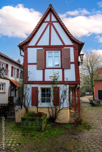 Fototapeta Naklejka Na Ścianę i Meble -  Small medieval half-timbered house with red beams and whitewashed walls, Rhineland-Palatinate, Germany