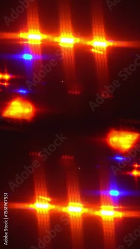 Blurred vertical looping red and blue flashing police lights create an intense, dramatic glow in the dark. This abstract visual evokes emergency response, law enforcement, or high-stakes nighttime.