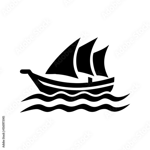 Silhouette of a sailboat with three sails on the water