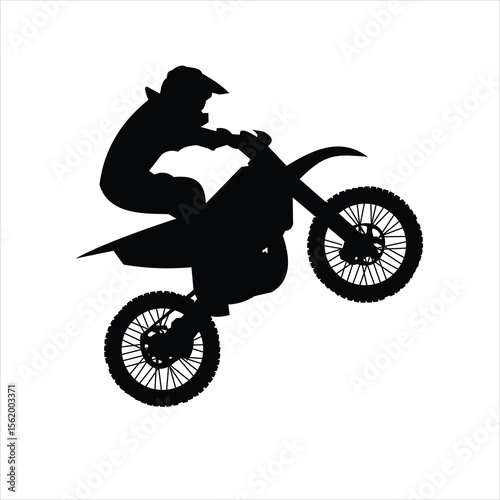  a black silhouette of a motocross rider on a dirt bike, captured in mid-action.
