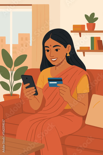Indian woman making online payment with credit card on a smartphone. Happy girl in sari shopping online from home sofa. E-commerce, mobile banking, fintech, digital transaction concept.