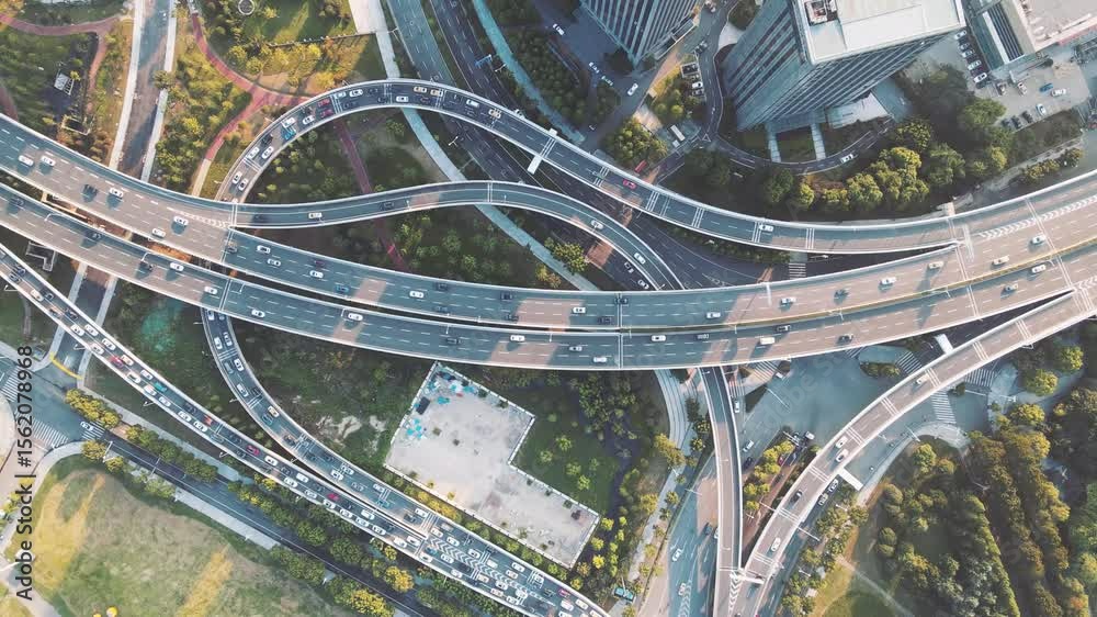 Aerial view of intricate urban viaducts showcasing city transportation networks and green spaces Aerial view of intricate urban viaducts showcasing city transportation networks and green spaces