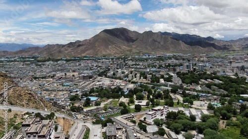 Stunning aerial panorama showcases Shigatse City amidst the breathtaking Tibetan landscape