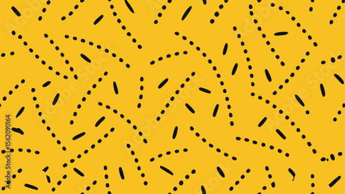 Yellow background with scattered black dots and dashes pattern abstract