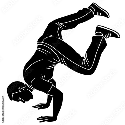 Silhouette of a man performing a breakdancing freeze on his hands