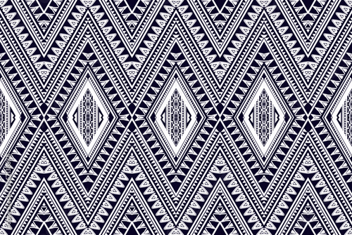 Seamless tribal geometric pattern in black and white. Intricate symmetrical design with ethnic, Aztec-inspired diamond shapes, arrows, and decorative lines, ideal for textiles, wallpapers