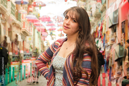 white-skinned latina woman walking on the street of the witches in the city of la paz, bolivia - walking concept