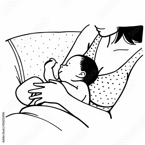 Mother breastfeeding her baby in a comfortable position with a polka dot pattern