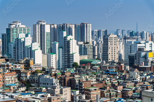 Seoul cityscapes, skyline, high rise office buildings and skyscrapers with blue sky and cloud in Seoul city, South Korea