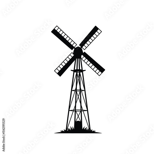 Black and white image of a traditional Dutch windmill with sails against a dark sky, evoking old European agricultural power