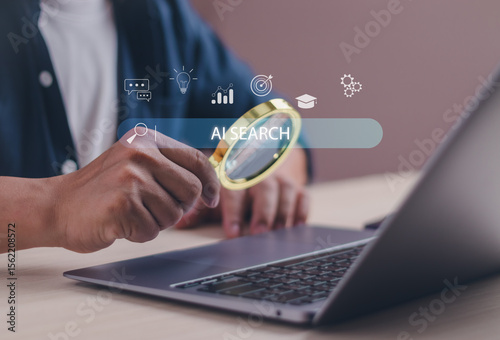 Concept of using AI search or automation technology, male hand holding magnifying glass and virtual search bar while using laptop show searching for information with internet technology connection
