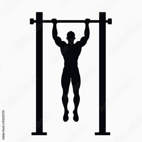 Silhouette of a Muscular Man Performing a Pull-Up Exercise for Strength Training