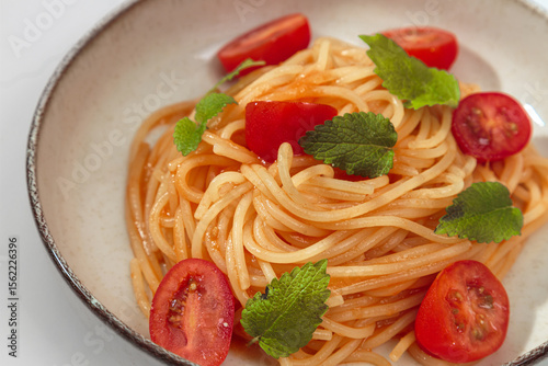 pasta with cherry tomatoes in a bowl