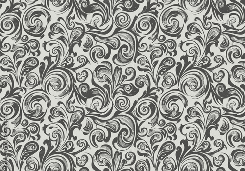 A patterned background of gray and black swirls with leaf and tendrillike motifs