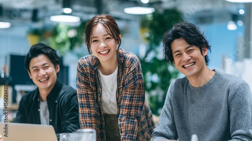 Creative Startup Team Smiling Around Laptop. Generative AI