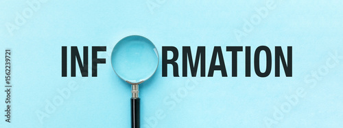 A magnifying glass is on a blue background with the word Information written bel