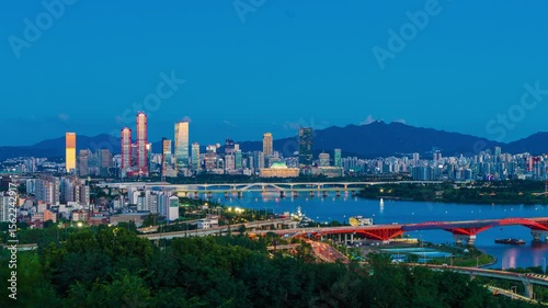 Wallpaper Mural Timelapse, Mapo-gu, Seoul, South Korea - July 29, 2025: Day and night view of Yanghwa Bridge on Han River against National Assembly and skyscrapers of financial district 
 Torontodigital.ca
