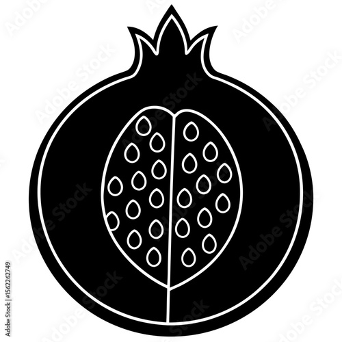 A perfectly ripe pomegranate split open on a dark marble surface
