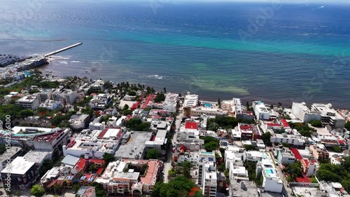 Aerial drone view of downtown area in playa del carmen with beach and turquoise blue Caribbean Sea on a sunny day