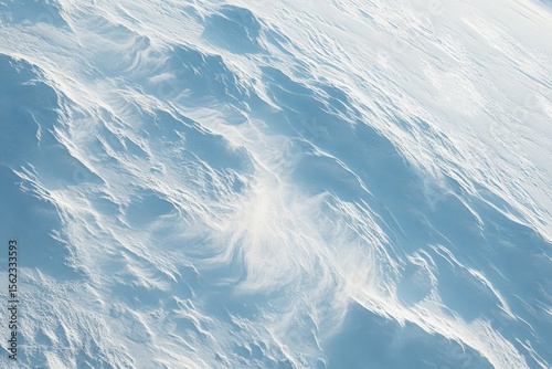 Aerial view of icy blue ridged landscape