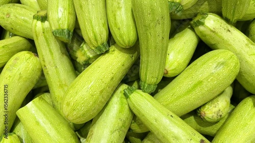 buying vegetables(eggplant, zucchini,) at the market