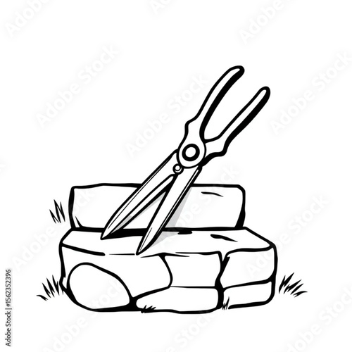 A pair of garden shears on a stone step