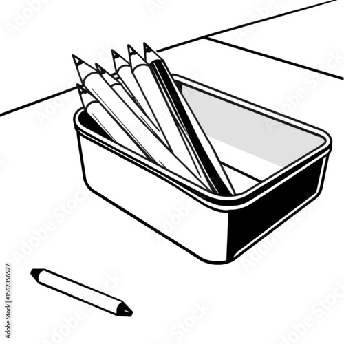 A tin of coloured pencils on a school desk