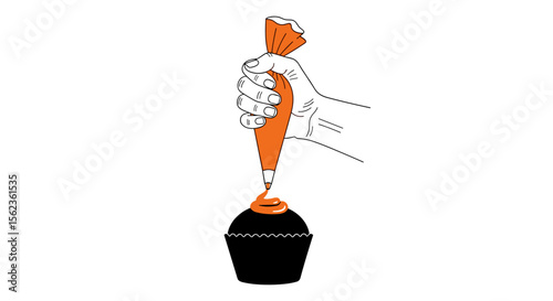 Hand decorating black cupcake with orange icing from piping bag on white background