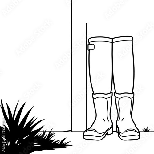A pair of wellington boots by a back door