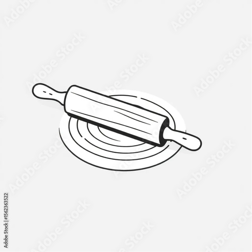 A wooden rolling pin on a pastry mat