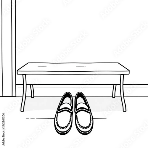 A pair of loafers under a hall bench