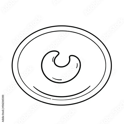 A single cashew on a snack plate
