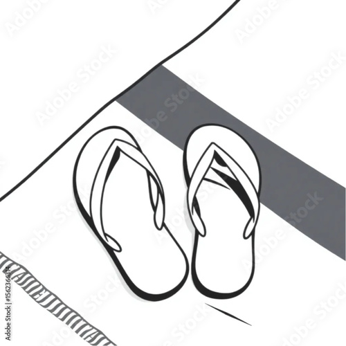 A pair of flip-flops on a beach towel