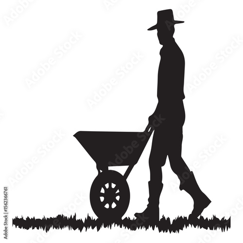 Silhouette of a farmer wearing a hat pushing a wheelbarrow across grass