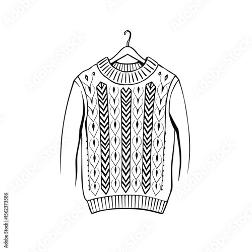 A woollen jumper on a coat hanger