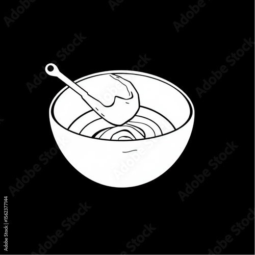 A ceramic mixing bowl with cake batter