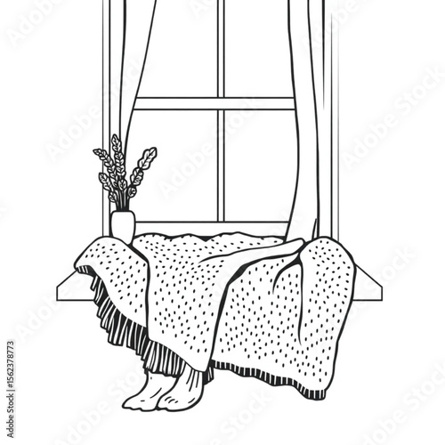 A woollen throw on a window seat